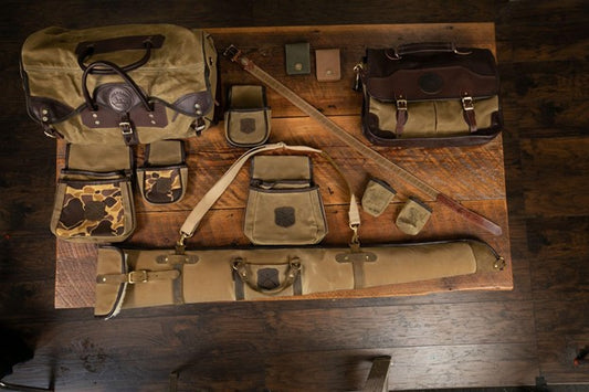 A table with Over Under field gear spread out on it